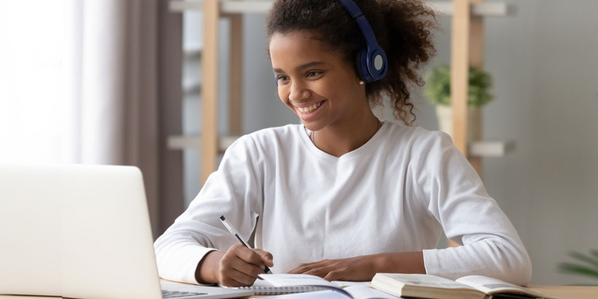 student using a computer at home