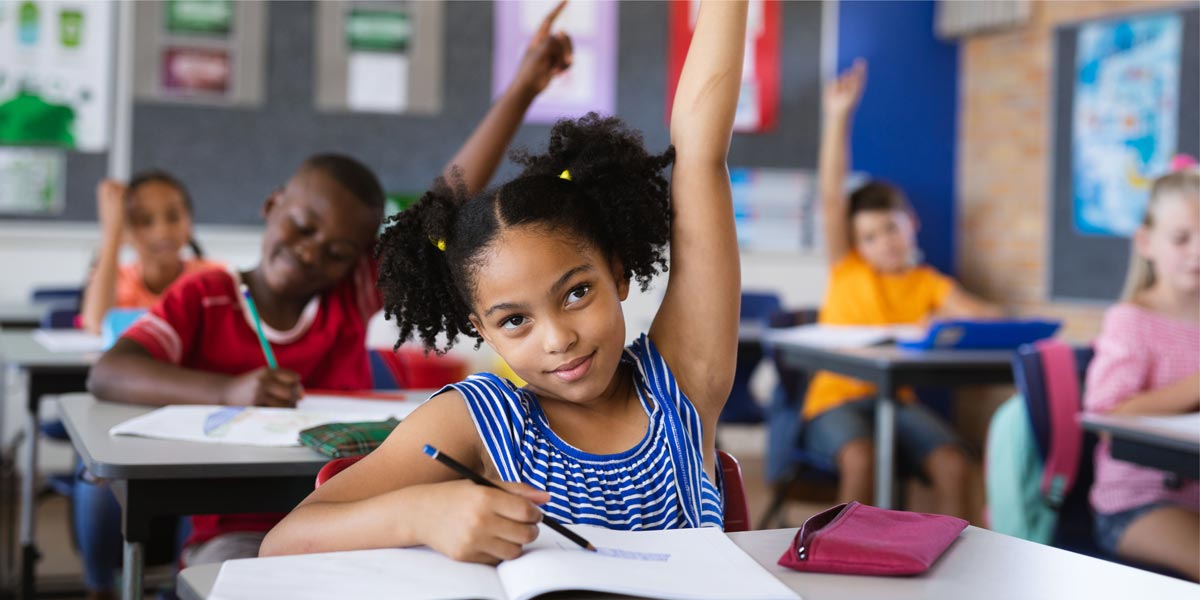 student with hand raised