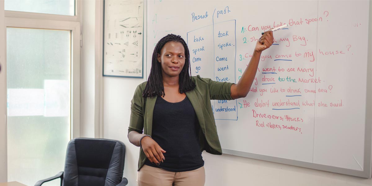 teacher standing in front of a classroom