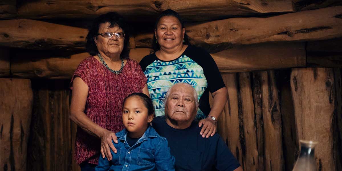 A native family posing for a picture