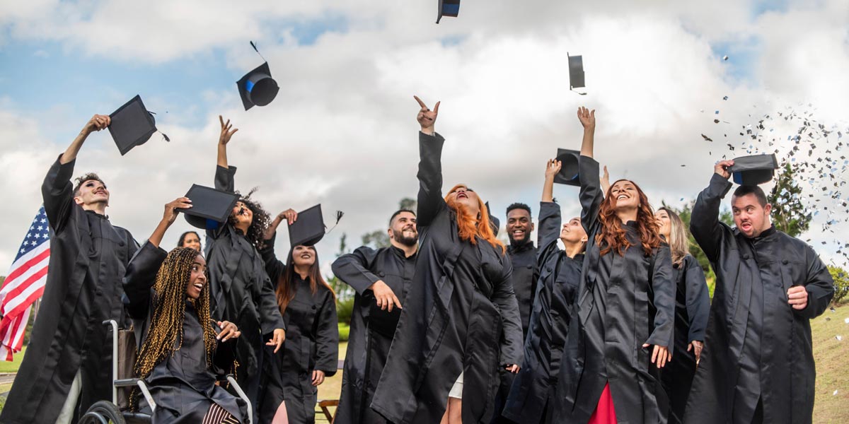 college grads throwing their caps in the air