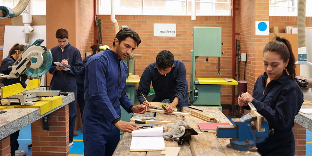 A group of students and a teacher in a woodworking class