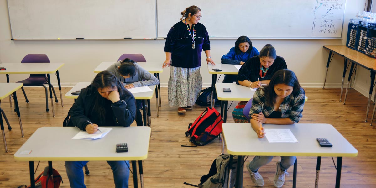 teacher and students in a classroom