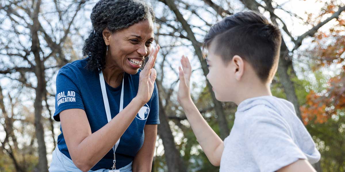 an adult volunteer with a student