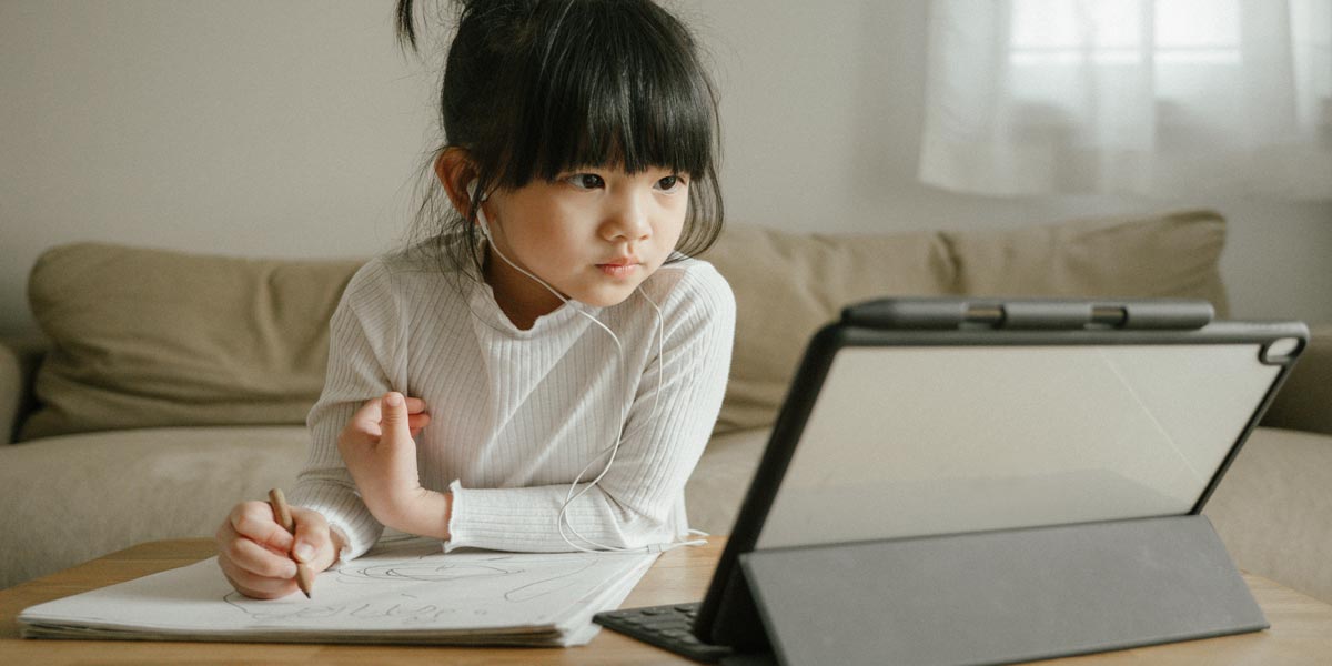 student using an ipad at home