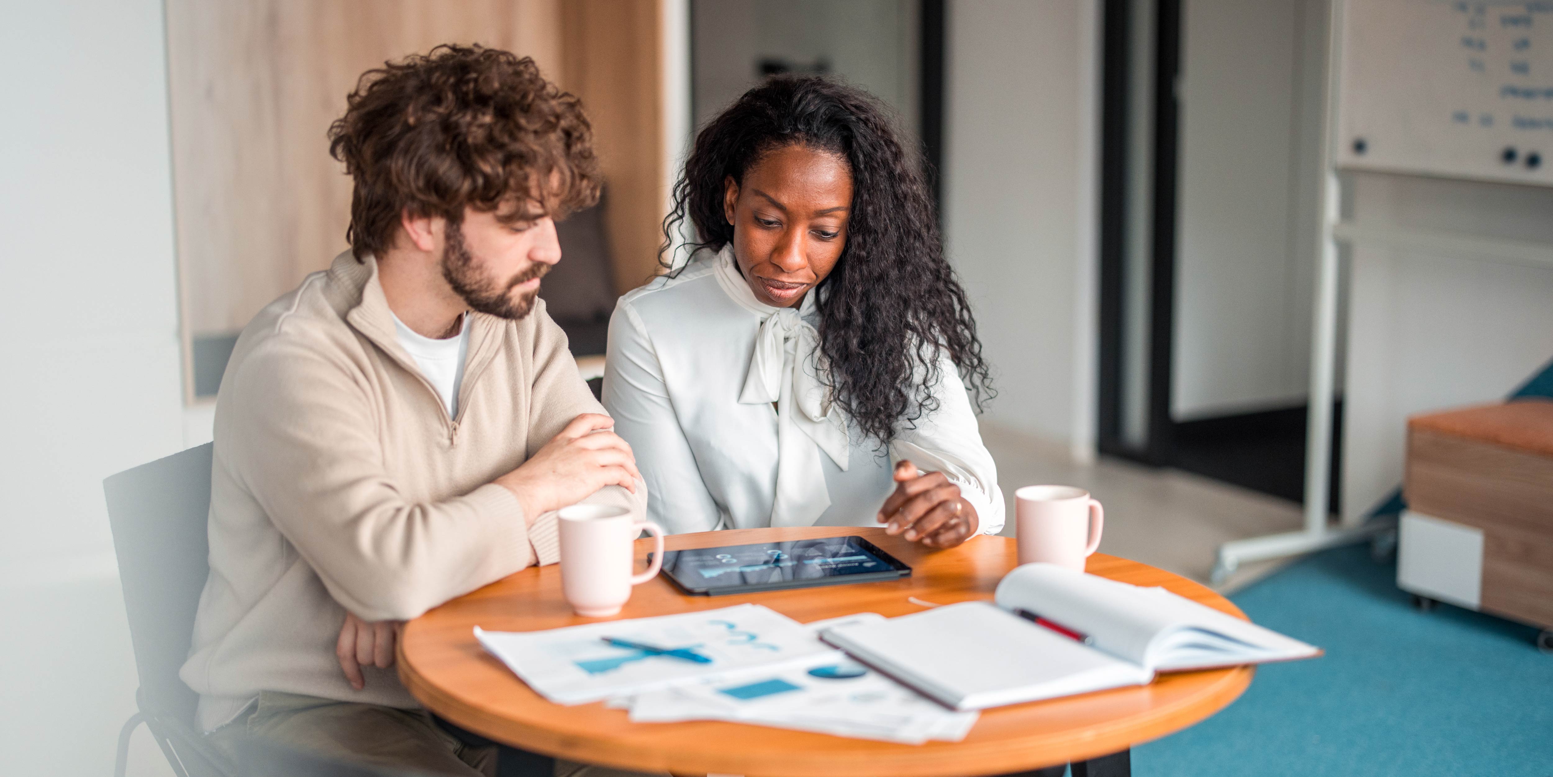 Two people looking at data