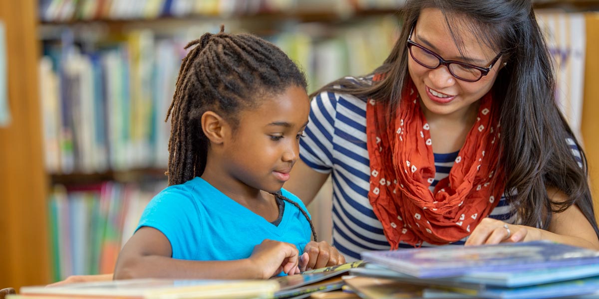 student reading in the classroom