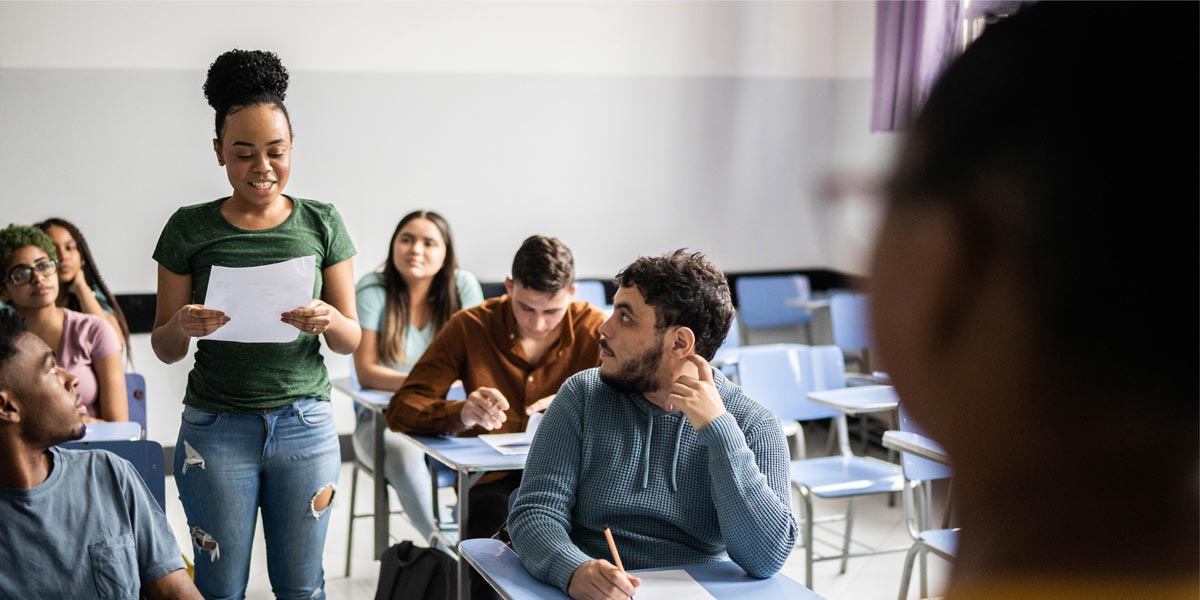 teacher and students in a classroom