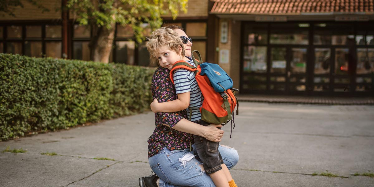 an adult carrying a child