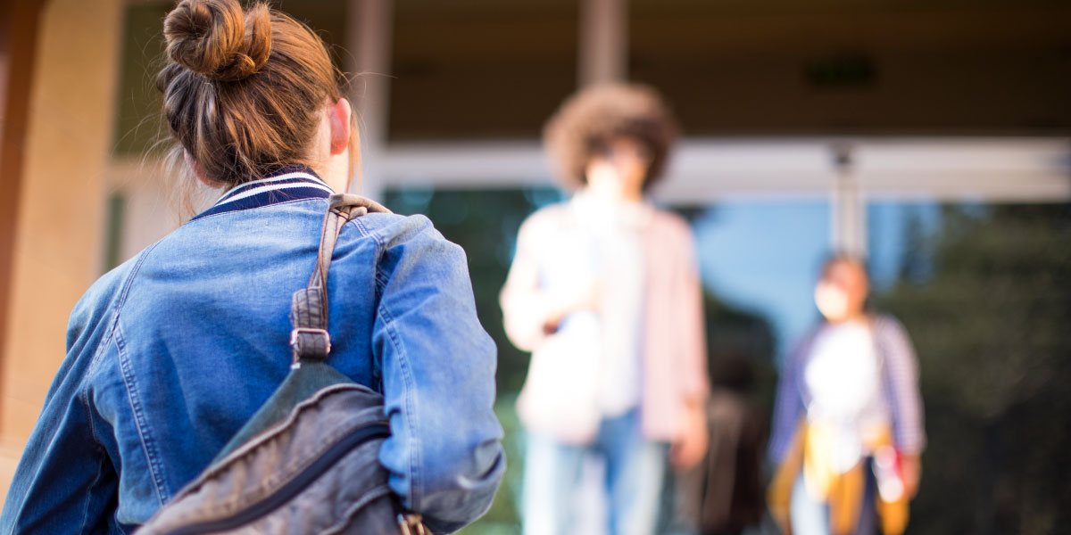 A student walking up stairs