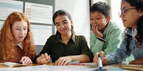 student writing on a desk