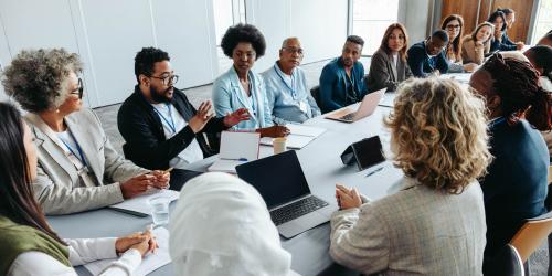 People sitting around a table having a discussion