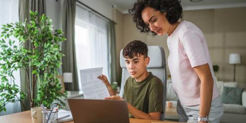 a parent and student at a computer